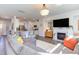 Open living area showcasing a fireplace, comfortable seating, and seamless transition to the kitchen at 2929 Great Lawn Rd, Apex, NC 27502
