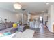 Spacious open-concept with living room flowing into a modern kitchen, and plenty of natural light at 2929 Great Lawn Rd, Apex, NC 27502