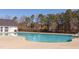 Large community swimming pool with a sunbathing area, perfect for summer relaxation at 2929 Great Lawn Rd, Apex, NC 27502