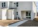 Home's exterior featuring siding, an air conditioning unit, a door and sliding glass door leading to backyard at 3010 Garner Rd # 102, Raleigh, NC 27610