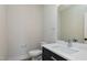 A bathroom with a modern sink, a large mirror, and a toilet at 3010 Garner Rd # 102, Raleigh, NC 27610