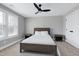 Inviting bedroom with neutral walls, ceiling fan, carpeted floors, and a bright window with blinds at 3010 Garner Rd # 102, Raleigh, NC 27610