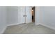 Bedroom featuring neutral carpet, a window with blinds, and an ensuite bathroom at 3010 Garner Rd # 102, Raleigh, NC 27610