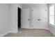 Bedroom featuring neutral carpet, a window with blinds, and a closet at 3010 Garner Rd # 102, Raleigh, NC 27610