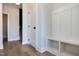 Bright entryway with a built-in bench and storage, coat hooks, and wood flooring at 3010 Garner Rd # 102, Raleigh, NC 27610