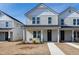 Charming two-story townhouse with a welcoming front porch and well-maintained lawn at 3010 Garner Rd # 102, Raleigh, NC 27610