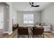 Bright living room with hardwood floors, ceiling fan, neutral paint, and comfortable seating at 3010 Garner Rd # 102, Raleigh, NC 27610