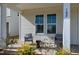 Inviting front porch with seating area, perfect for enjoying the outdoors at 3010 Garner Rd # 102, Raleigh, NC 27610