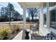 Cozy front porch with chairs and side table, ideal for relaxation and curb appeal at 3010 Garner Rd # 102, Raleigh, NC 27610