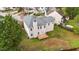 Aerial view of the backyard and patio with green grass at 3208 Marblewood Ct, Raleigh, NC 27604