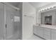 Bright bathroom with glass shower, white tile and vanity at 3208 Marblewood Ct, Raleigh, NC 27604