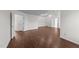 Large bedroom featuring wood-look floors and several doors at 3208 Marblewood Ct, Raleigh, NC 27604