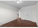 Large bedroom with wood-look floors, closet, and bathroom entrance at 3208 Marblewood Ct, Raleigh, NC 27604