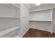 Spacious walk-in closet with shelving, rod and wood flooring at 3208 Marblewood Ct, Raleigh, NC 27604