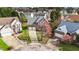 Aerial shot of a two story brick home with a large driveway and two car garage at 3208 Marblewood Ct, Raleigh, NC 27604