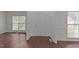 Inviting foyer with wood-look flooring and a white front door leading to the light-filled living spaces at 3208 Marblewood Ct, Raleigh, NC 27604