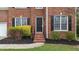 Close-up of the brick front entrance and tidy landscaping with black mulch and bright shrubbery at 3208 Marblewood Ct, Raleigh, NC 27604