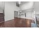 Living area with open floor plan and view into kitchen, staircase to upper level at 3208 Marblewood Ct, Raleigh, NC 27604