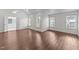 Spacious main bedroom features vaulted ceilings, wood-look floors, and abundant natural light at 3208 Marblewood Ct, Raleigh, NC 27604