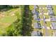 Aerial view of neighborhood with golf course and lake from above at 340 Olde Liberty Dr, Youngsville, NC 27596