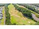 Aerial view of golf course, and lake from above at 340 Olde Liberty Dr, Youngsville, NC 27596