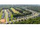 Community aerial view showcasing golf course, lake, and nearby homes at 340 Olde Liberty Dr, Youngsville, NC 27596