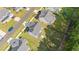 Aerial view of gray roof, long driveway, and well manicured lot at 340 Olde Liberty Dr, Youngsville, NC 27596