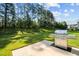 Spacious backyard featuring a well-maintained lawn and a stainless steel grill at 340 Olde Liberty Dr, Youngsville, NC 27596