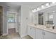 Stylish bathroom featuring dual sinks, a large mirror, and modern fixtures at 340 Olde Liberty Dr, Youngsville, NC 27596