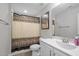 Clean bathroom featuring a shower with patterned curtain and a modern vanity at 340 Olde Liberty Dr, Youngsville, NC 27596