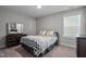 Comfortable bedroom with neutral tones, carpet flooring, and a window offering natural light at 340 Olde Liberty Dr, Youngsville, NC 27596