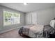 Cozy bedroom featuring a comfortable bed and a bright window offering natural light at 340 Olde Liberty Dr, Youngsville, NC 27596