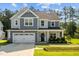 Charming two-story home with a manicured lawn, attached two car garage, and beautiful curb appeal at 340 Olde Liberty Dr, Youngsville, NC 27596