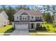 Charming home featuring a two car garage, and manicured lawn at 340 Olde Liberty Dr, Youngsville, NC 27596