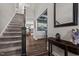 Grand two-story foyer with hardwood floors, staircase, and elegant decor, creating a welcoming entrance at 340 Olde Liberty Dr, Youngsville, NC 27596