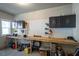 Spacious garage featuring built-in storage cabinets and a long workbench area for projects at 340 Olde Liberty Dr, Youngsville, NC 27596