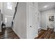 Bright hallway leading to the front door and staircase, featuring convenient storage and mudroom area at 340 Olde Liberty Dr, Youngsville, NC 27596