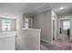 Upstairs hallway leading to bedroom and bathroom, providing a sense of privacy and separation at 340 Olde Liberty Dr, Youngsville, NC 27596