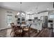 Open kitchen with a center island and stainless appliances at 340 Olde Liberty Dr, Youngsville, NC 27596