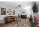 Cozy living room with a fireplace, hardwood floors, and stylish decor for comfortable living at 340 Olde Liberty Dr, Youngsville, NC 27596