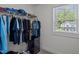 Functional walk-in closet with ample hanging space and built-in shelving for organized storage at 340 Olde Liberty Dr, Youngsville, NC 27596