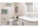 Bathroom featuring a marble countertop, white cabinets, and modern fixtures at 3721 Browning Pl, Raleigh, NC 27609