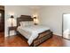 Bedroom with decorative wood bed frame, matching side tables, and ample closet space at 3721 Browning Pl, Raleigh, NC 27609
