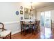 Bright dining room with seating for six and natural light from sliding glass door at 3721 Browning Pl, Raleigh, NC 27609