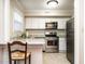 Bright kitchen featuring stainless steel appliances, granite countertops, and a breakfast bar at 3721 Browning Pl, Raleigh, NC 27609