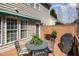Back deck offers outdoor dining with a patio table, chairs, awning, and a barbeque at 3924 Sunset Maple Ct, Raleigh, NC 27612
