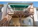 A view of the back deck shows the underside support structure, and stairs leading down to the yard at 3924 Sunset Maple Ct, Raleigh, NC 27612