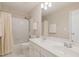 Bright bathroom with double vanity, shower, and bathtub at 3924 Sunset Maple Ct, Raleigh, NC 27612