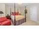 Bedroom with a four-poster bed and classic furnishings at 3924 Sunset Maple Ct, Raleigh, NC 27612