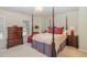 Bedroom with a four-poster bed and classic furnishings at 3924 Sunset Maple Ct, Raleigh, NC 27612
